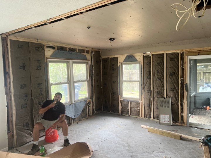 Waverly GA home interior stripped to bare studs with exposed insulation and wiring before the whole-home renovation